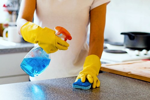 Professional oven cleaner in SW3 deep cleaning a kitchen oven