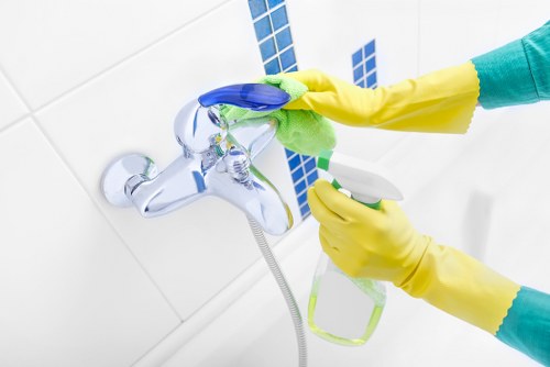 Cleaner in SW3 maintaining a spotless office workspace