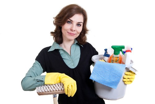 Carpet cleaning technician assessing flooring condition prior to treatment